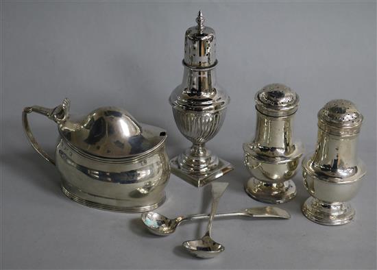 A George III silver mustard pot, a Victorian silver caster/pepperette, a pair of silver peppers and two spoons (one silver).